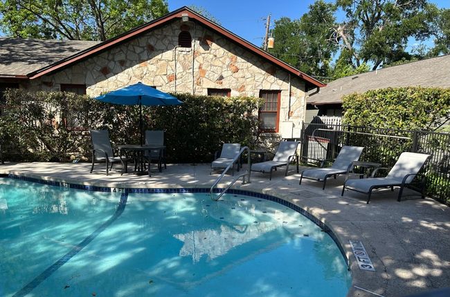 Community pool with a patio area | Image 13