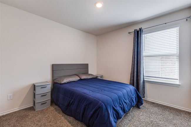 Bedroom featuring baseboards and carpet | Image 20