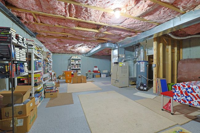 Unfinished below grade area with gas water heater and heating unit | Image 19