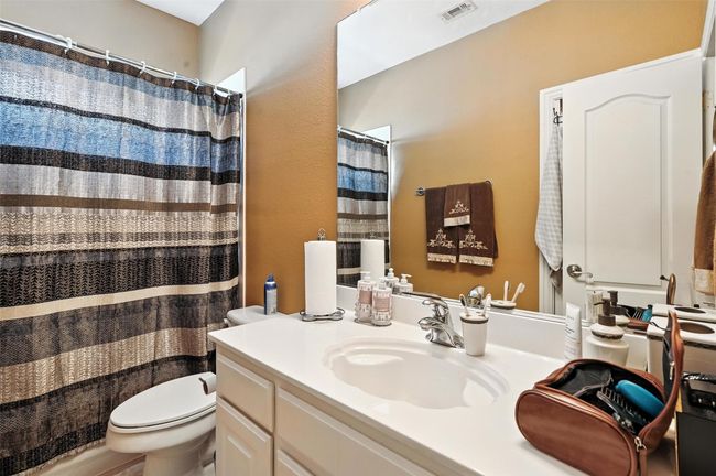 Bathroom featuring vanity and a shower with shower curtain | Image 24
