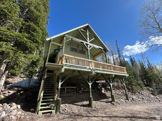 View of front of home featuring stairs and a deck | Image 4