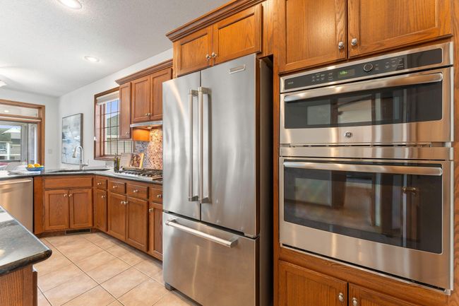 9946 Wellington Ln, Townhouse with 4 bedrooms, 3 bathrooms and null parking in Woodbury MN | Image 20