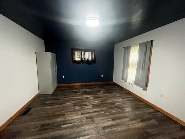 Entryway featuring dark wood-style flooring and baseboards | Image 6