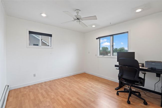 Exercise area featuring wallpapered walls, carpet flooring, a wainscoted wall, and recessed lighting | Image 29