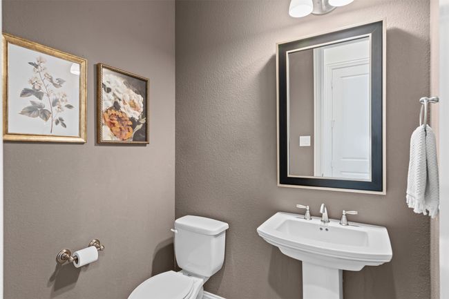 Half bath with toilet and a sink | Image 8
