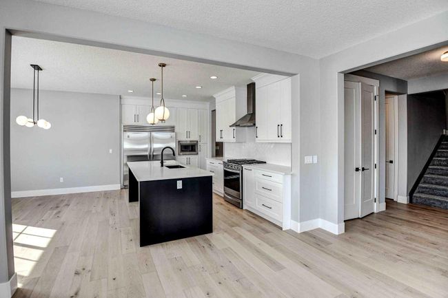 1209 Coopers Drive Sw, Home with 4 bedrooms, 2 bathrooms and 3 parking in Airdrie AB | Image 8