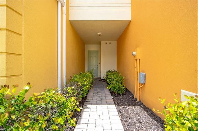 Entrance to property with stucco siding | Image 4