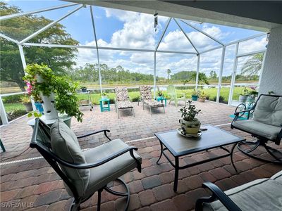 View of patio featuring glass enclosure | Image 1