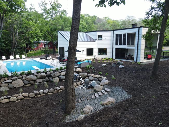 Pool equipment was designed to be out of the way. Stairs lead to fire pit and creek | Image 44