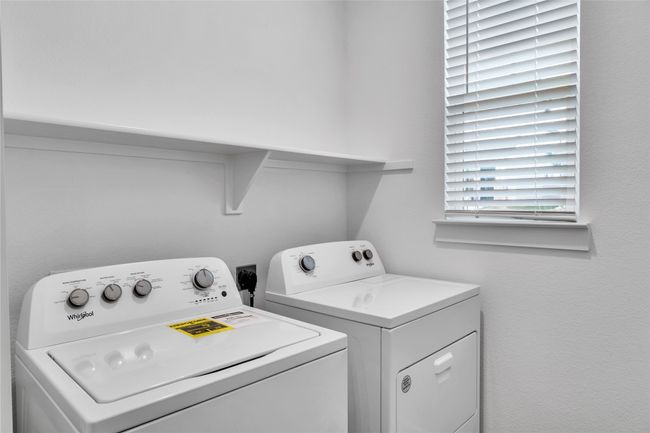 Laundry area featuring laundry area and separate washer and dryer | Image 9