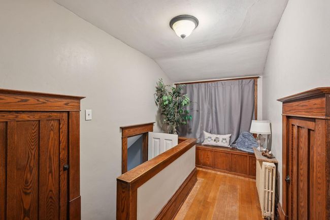 Here is the end of the hall/access to the rear staircase that leads to the large foyer. | Image 46