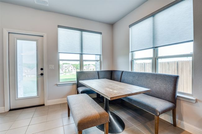 Dining space with baseboards and light tile patterned floors | Image 12