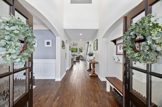 Stunning wood floors throughout the first floor draw you into the gracious entry. | Image 6