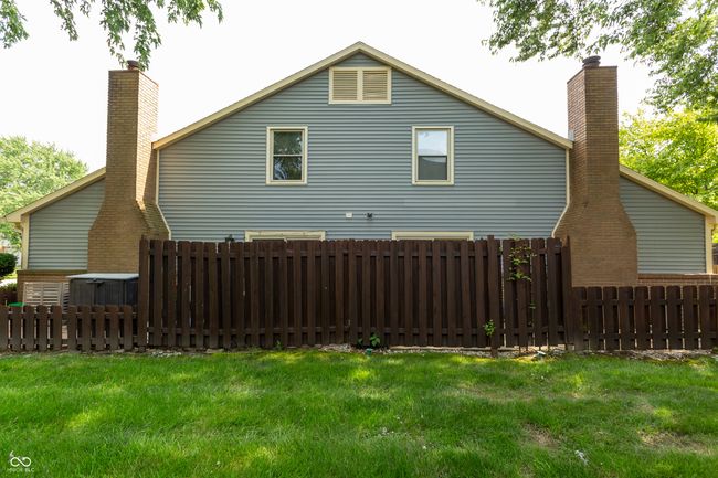 view of side of property featuring a chimney | Image 34