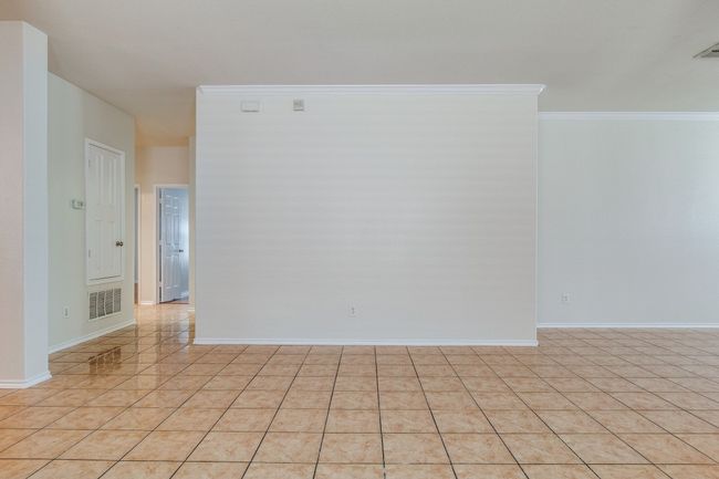 Unfurnished room featuring crown molding, visible vents, and baseboards | Image 15