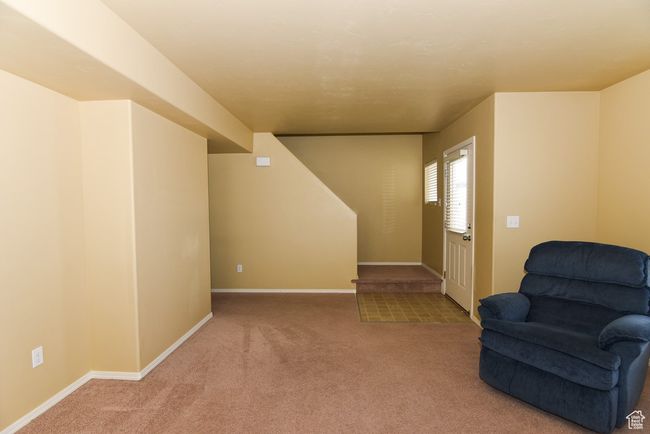 Living area with baseboards and carpet floors | Image 10