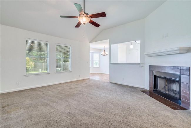 Living room featuring gas fireplace | Image 9
