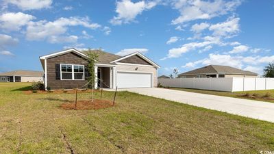 View of front of house with a garage and a front yard | Image 2