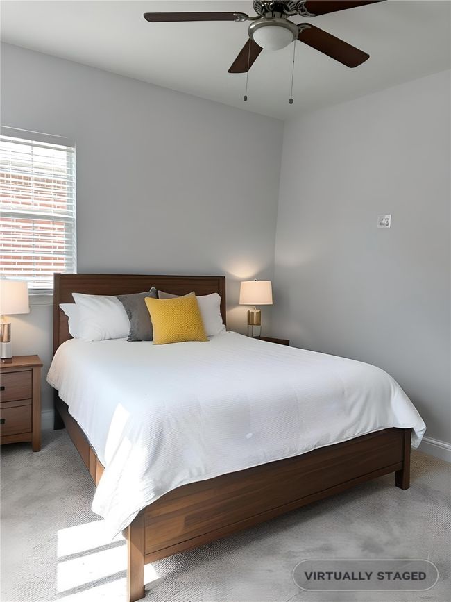 Staged Bedroom with light carpet and a ceiling fan | Image 13