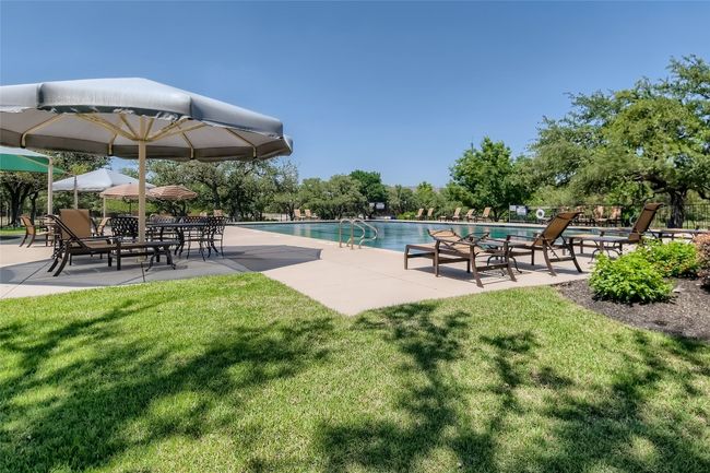 Community pool featuring a yard and a patio area | Image 30