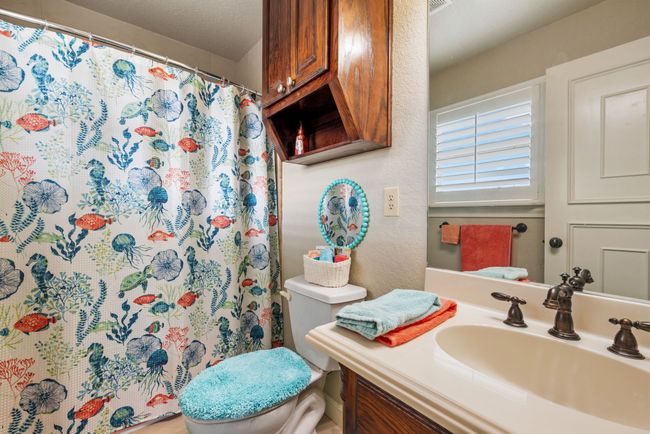 Bathroom featuring vanity and a shower with shower curtain | Image 30