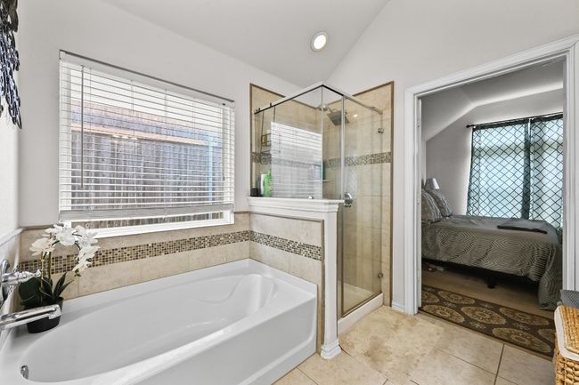 Watch your exhaustion wash away with one shower or bath in this gorgeous bathroom! | Image 15