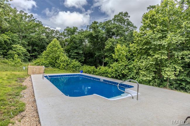 Swimming pool featuring a patio area | Image 55