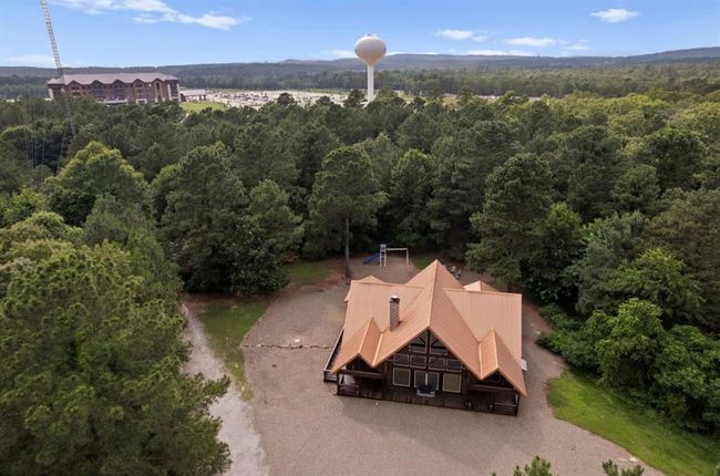 View from above of property featuring a heavily wooded area | Image 6