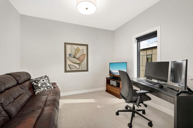 3rd bedroom with barn-style doors, currently being used as an office | Image 21