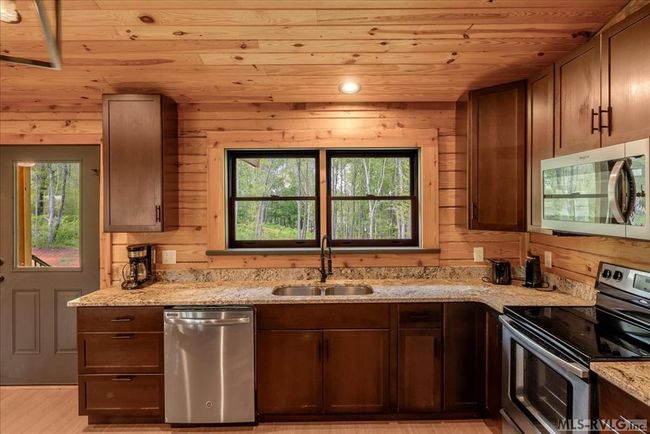 Kitchen with granite tops and stainless steel appl | Image 16