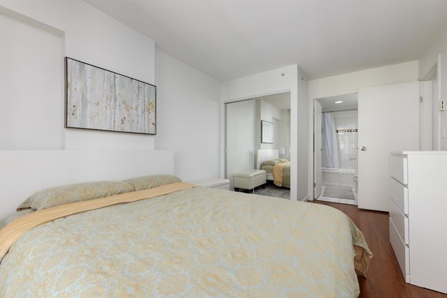 Bedroom with dark wood finished floors, ensuite bath, and recessed lighting | Image 8