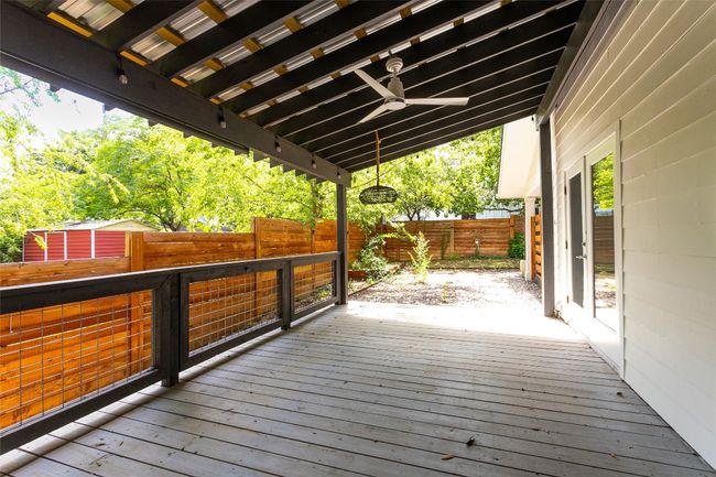 Deck with a fenced backyard and ceiling fan | Image 25