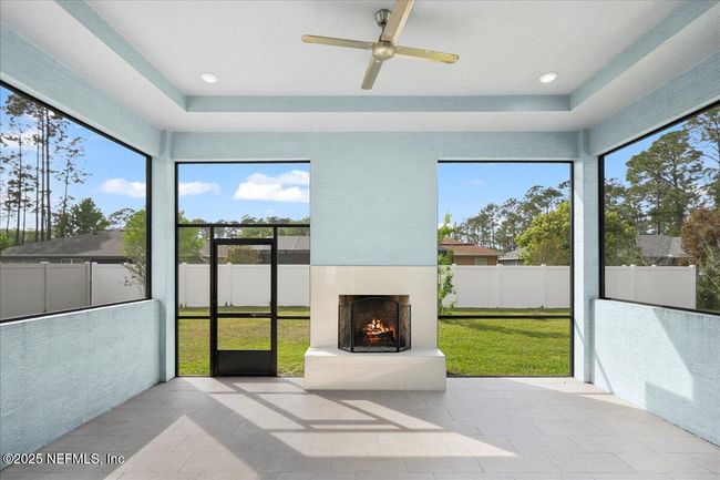 Screened patio fireplace | Image 26