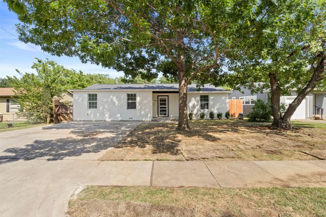 View of yard with a patio area and an outbuilding | Image 6