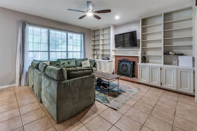 LOTS and lots of storage in this family room and a wonderful view to the enormous private back yard! | Image 14
