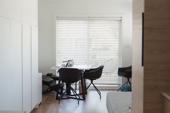Dining space with wood finished floors and an office area | Image 11