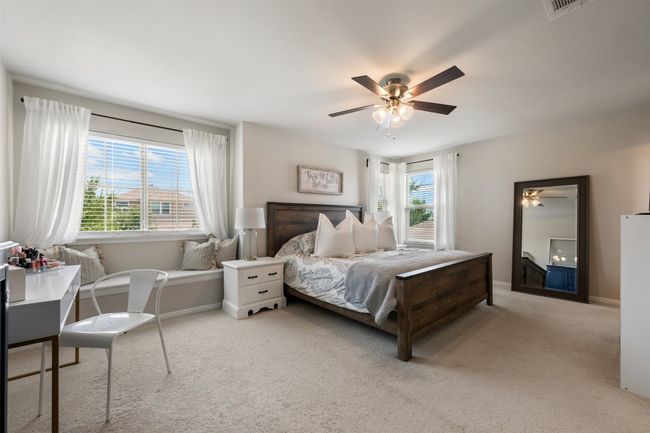 Primary Bedroom with carpet floors, baseboards, and ceiling fan | Image 20