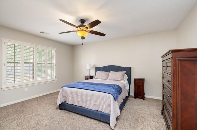 Spacious and light-filled, the secondary bedrooms each offer room to grow, rest, or create—ideal for guests, family, or home office setups. Fresh carpet installed in 2025 adds comfort and a move-in ready feel throughout the upstairs. | Image 27