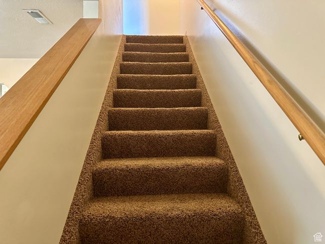 View of stairs off of living room to the upstairs bedrooms | Image 15