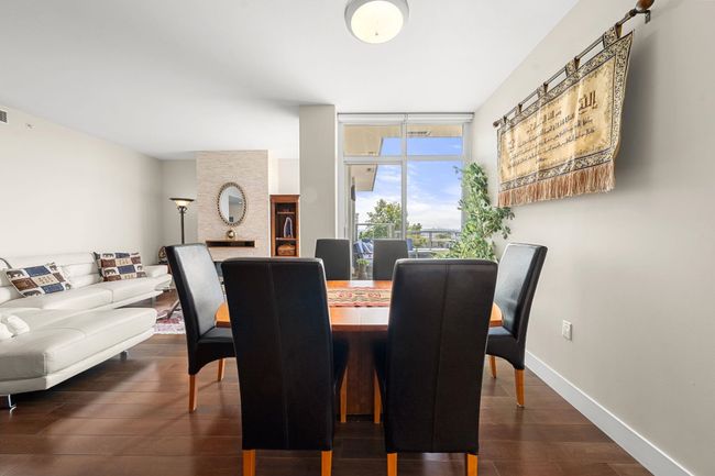 Dining room featuring dark wood-style floors and baseboards | Image 8