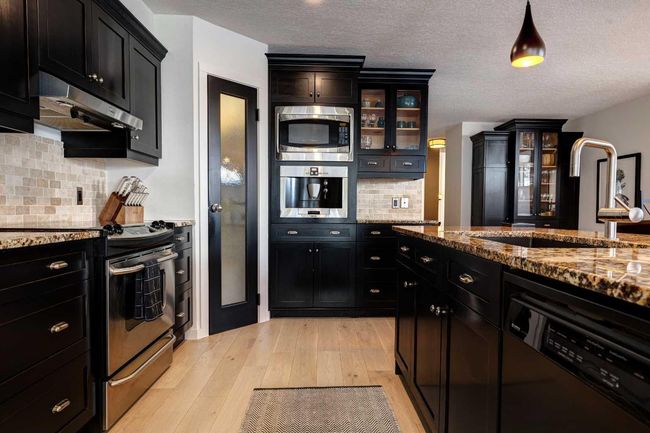 B - 116 Otter, Home with 5 bedrooms, 4 bathrooms and 3 parking in Banff AB | Image 9