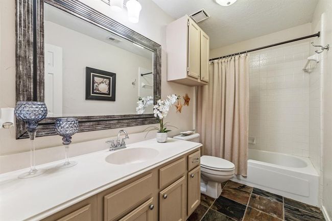Upstairs bathroom features nice layout and elegant slate flooring. | Image 23
