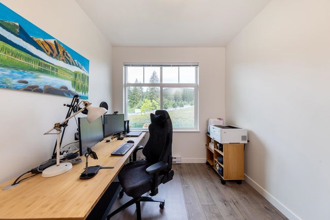 Office featuring wood finished floors, baseboards, and baseboard heating | Image 19