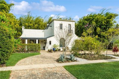 Welcome Home to this Stunning Oasis located in the Highly Sought after 32804 Zip Code of the Renowned College Park Area! Nestled in the Orlando Country Club Community, this charming 1925 Estate has been tastefully renovated with no expense spared all while preserving its original character and beauty! | Image 1