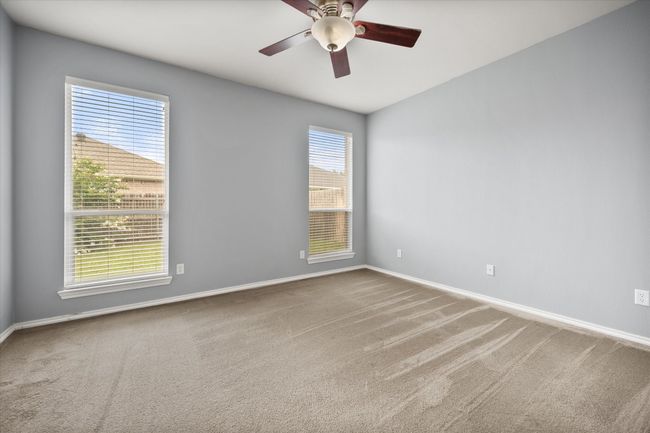 Empty room featuring carpet and a ceiling fan | Image 13