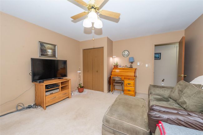 Living area featuring carpet and a ceiling fan | Image 20