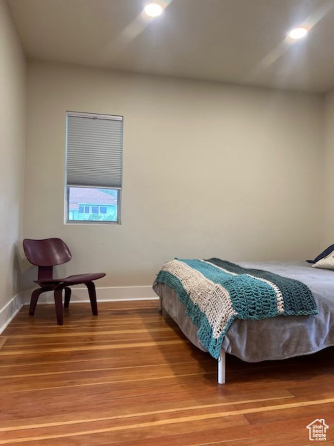 Bedroom with baseboards, light wood-style floors, and recessed lighting | Image 15