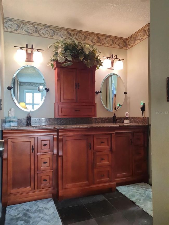 with plenty of cabinets for storage | Image 14