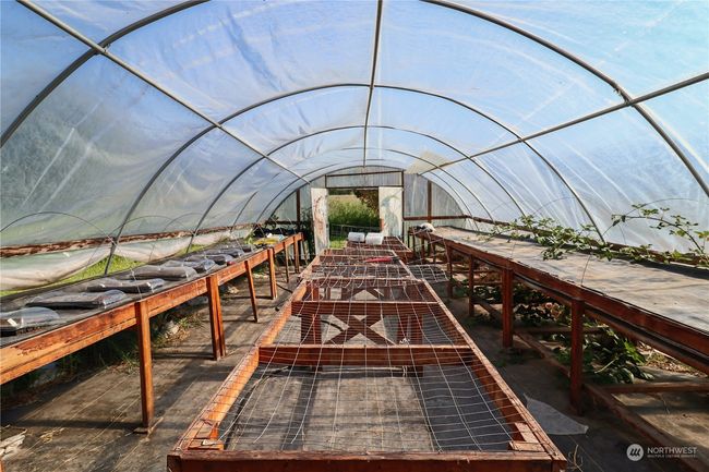 The green house has benches and is ready to grow | Image 35