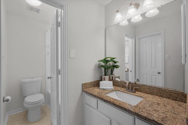 Jack and Jill Bathroom sink and closet by bedroom 4. | Image 29